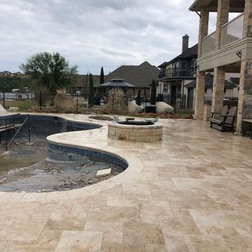 Stone retaining wall with flowerbed