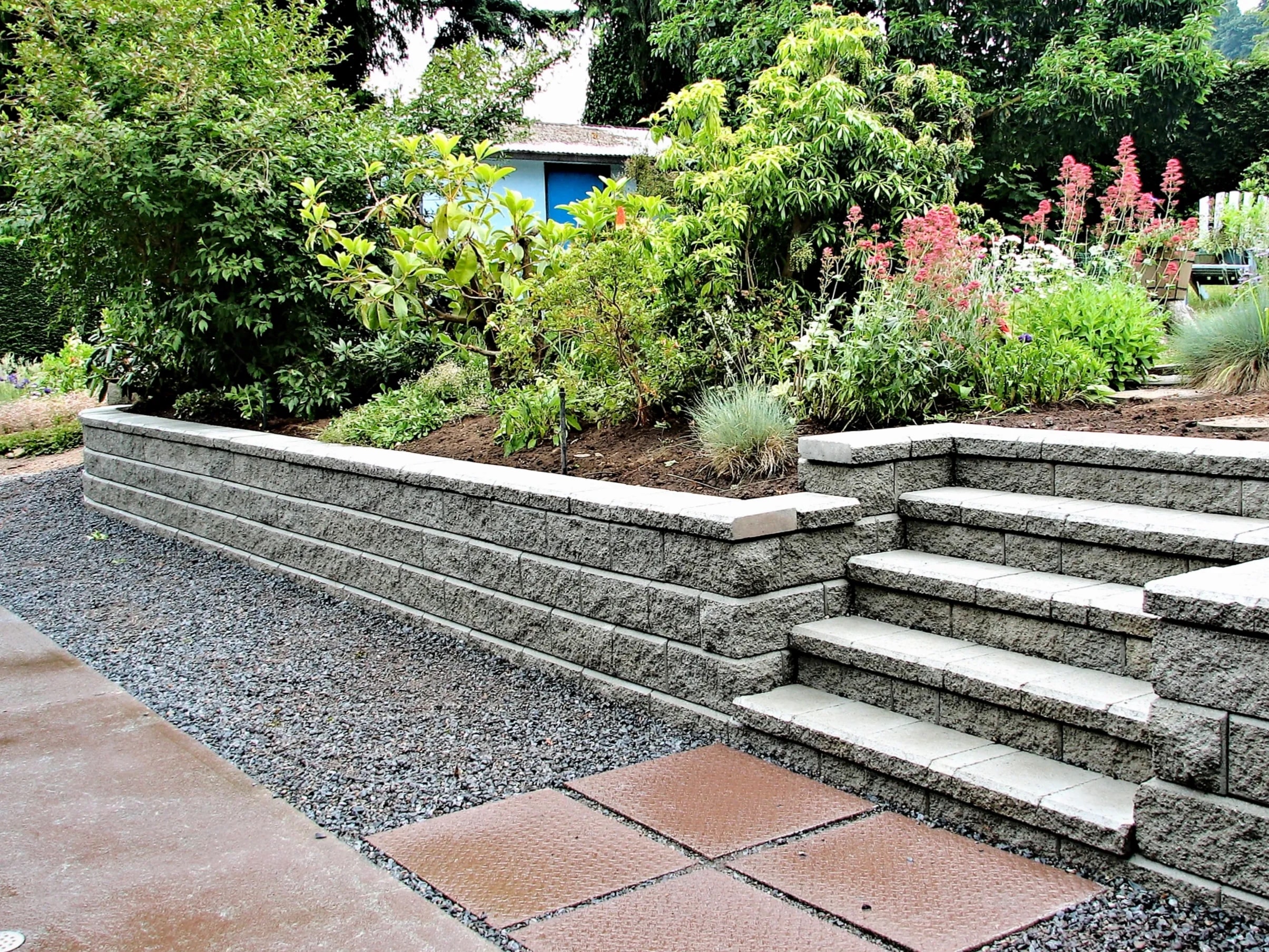 Natural stone retaining wall in DFW yard